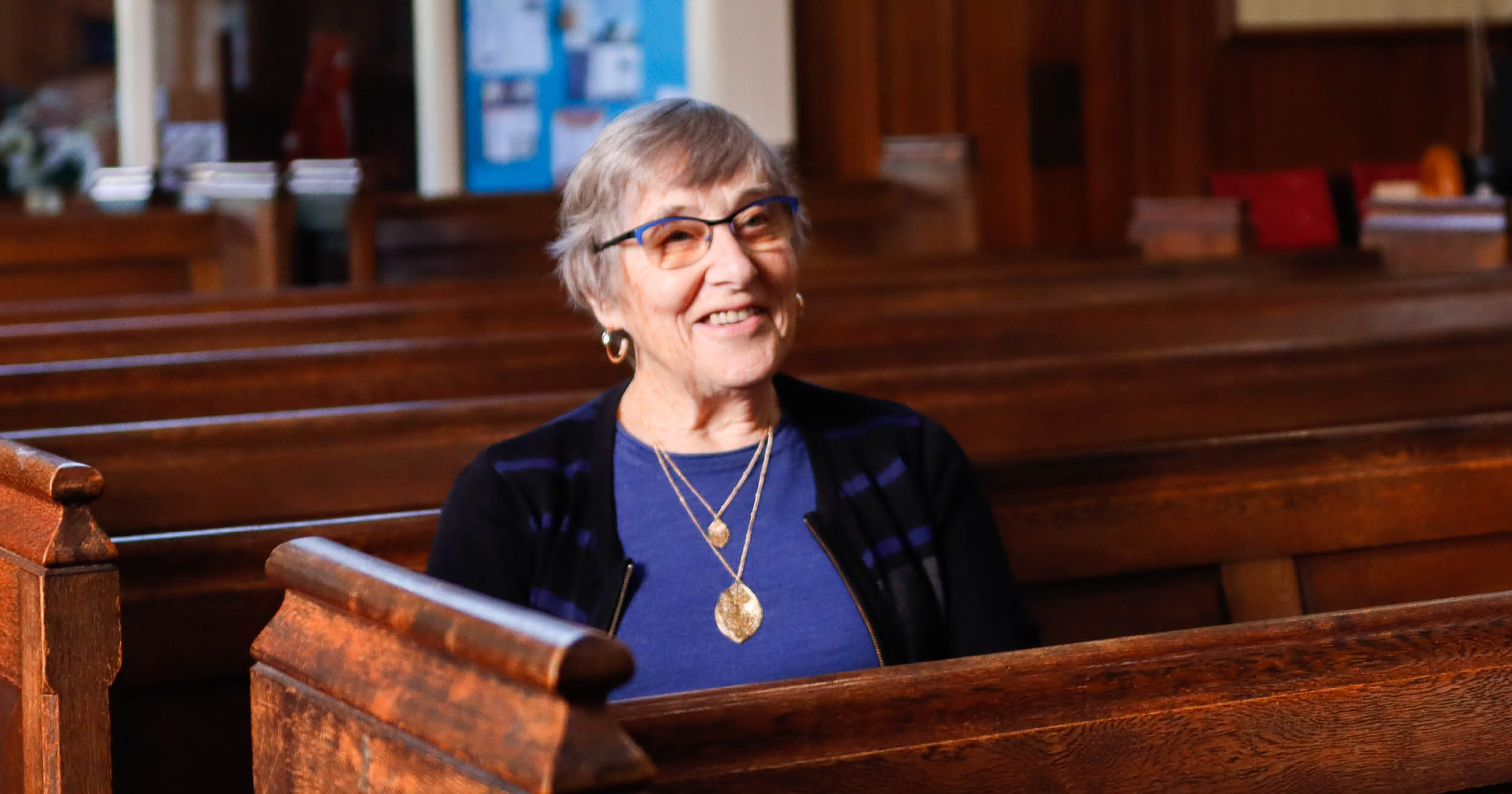 mary-website-image woman-sitting-in-church-chair